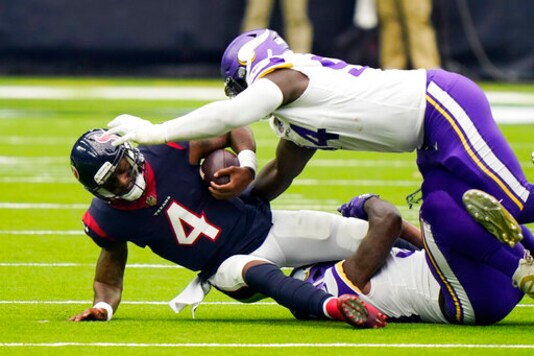Houston Texans quarterback Deshaun Watson (4) is sacked by Minnesota Vikings defensive tackle Jaleel Johnson (94) during the second half of an NFL football game Sunday, Oct. 4, 2020, in Houston. (AP Photo/David J. Phillip)