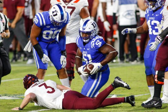 Duke defensive end Victor Dimukeje (51) recovers a fumble by Virginia Tech quarterback Braxton Burmeister (3) during the second half of an NCAA college football game Saturday, Oct. 3, 2020, in Durham, N.C. (Nell Redmond/Pool Photo via AP)