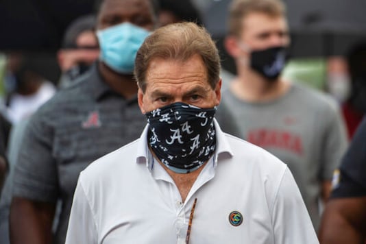 FILE - In this Aug. 31, 2020, file photo, Alabama head football coach Nick Saban leads his team as they march on campus, supporting the Black Lives Matter movement, in Tuscaloosa, Ala. The mid-week news that Alabama coach Nick Saban tested positive for COVID-19 added a challenging backdrop for the seasons first Top 5 matchup. Saban figures to be communicating his marching orders and input from home while offensive coordinator Steve Sarkisian is manning the show within the football building. (AP Photo/Vasha Hunt, File) FILE - In this Aug. 31, 2020, file photo, Alabama head football coach Nick Saban leads his team as they march on campus, supporting the Black Lives Matter movement, in Tuscaloosa, Ala. The mid-week news that Alabama coach Nick Saban tested positive for COVID-19 added a challenging backdrop for the seasons first Top 5 matchup. Saban figures to be communicating his marching orders and input from home while offensive coordinator Steve Sarkisian is manning the show within the football building. (AP Photo/Vasha Hunt, File)