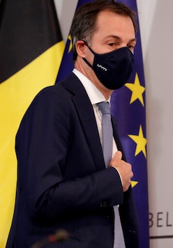 Belgium's Prime Minister Alexander De Croo arrives for a media conference, after a committee to discuss new restrictive measures regarding coronavirus, COVID-19, in Brussels, Friday, Oct. 16, 2020. (Stephanie Lecocq, Pool via AP) Belgium's Prime Minister Alexander De Croo arrives for a media conference, after a committee to discuss new restrictive measures regarding coronavirus, COVID-19, in Brussels, Friday, Oct. 16, 2020. (Stephanie Lecocq, Pool via AP)
