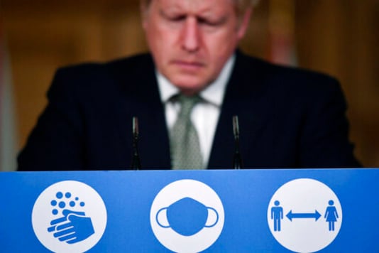 Britain's Prime Minister Boris Johnson listens during a coronavirus briefing in Downing Street, London, Monday, Oct. 12, 2020. (Toby Melville/Pool Photo via AP) Britain's Prime Minister Boris Johnson listens during a coronavirus briefing in Downing Street, London, Monday, Oct. 12, 2020. (Toby Melville/Pool Photo via AP)
