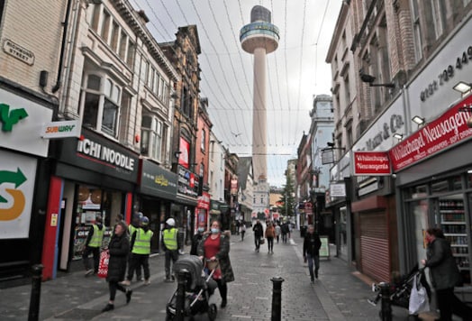 People walk down a shopping street in Liverpool, England, Wednesday, Oct. 14, 2020. As the first area in England slapped with strict new restrictions to curb the resurgent coronavirus that have shuttered pubs and imperiled thousands of jobs, Liverpool again feels it's being punished by policies made in Britain's capital, 180 miles (290 kilometers) to the south. (AP Photo/Frank Augstein) People walk down a shopping street in Liverpool, England, Wednesday, Oct. 14, 2020. As the first area in England slapped with strict new restrictions to curb the resurgent coronavirus that have shuttered pubs and imperiled thousands of jobs, Liverpool again feels it's being punished by policies made in Britain's capital, 180 miles (290 kilometers) to the south. (AP Photo/Frank Augstein)