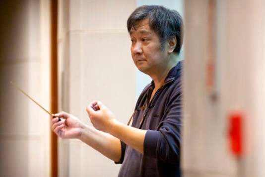 Conductor Zou Ye directs musicians from the Wuhan Philharmonic Orchestra as they rehearse a day before their concert to open the Beijing Music Festival, China's first classical music festival since the beginning of the COVID-19 outbreak, in Beijing, Friday, Oct. 9, 2020. China is holding its first classical music festival since the outbreak of the coronavirus pandemic featuring musicians from the global epicenter of Wuhan, in an attempt to aid in the psychological and emotional healing process. (AP Photo/Mark Schiefelbein) Conductor Zou Ye directs musicians from the Wuhan Philharmonic Orchestra as they rehearse a day before their concert to open the Beijing Music Festival, China's first classical music festival since the beginning of the COVID-19 outbreak, in Beijing, Friday, Oct. 9, 2020. China is holding its first classical music festival since the outbreak of the coronavirus pandemic featuring musicians from the global epicenter of Wuhan, in an attempt to aid in the psychological and emotional healing process. (AP Photo/Mark Schiefelbein)