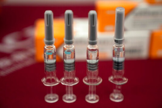In this Sept. 24, 2020, file photo, syringes of SARS CoV-2 Vaccine for COVID-19 produced by Sinovac are displayed during a media tour of its factory in Beijing. China is rapidly increasing the number of people receiving its experimental coronavirus vaccines, with a city offering one to the general public and a biotech company providing another free to students going abroad. (AP Photo/Ng Han Guan, File) In this Sept. 24, 2020, file photo, syringes of SARS CoV-2 Vaccine for COVID-19 produced by Sinovac are displayed during a media tour of its factory in Beijing. China is rapidly increasing the number of people receiving its experimental coronavirus vaccines, with a city offering one to the general public and a biotech company providing another free to students going abroad. (AP Photo/Ng Han Guan, File)