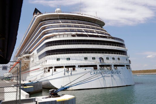 FILE - In this Saturday, April 4, 2020, file photo, Carnival cruise line ship Carnival Magic is docked at Port Canaveral, in Cape Canaveral, Fla. Carnival Cruise Line is canceling most U.S. sailings through the end of this year, the latest sign that the cruise industrys recovery from the coronavirus pandemic could still be many months away. The company said Thursday, Oct. 1, 2020, it is canceling sailings from all ports except its home ports of Miami and Port Canaveral, Florida. (AP Photo/John Raoux, File) FILE - In this Saturday, April 4, 2020, file photo, Carnival cruise line ship Carnival Magic is docked at Port Canaveral, in Cape Canaveral, Fla. Carnival Cruise Line is canceling most U.S. sailings through the end of this year, the latest sign that the cruise industrys recovery from the coronavirus pandemic could still be many months away. The company said Thursday, Oct. 1, 2020, it is canceling sailings from all ports except its home ports of Miami and Port Canaveral, Florida. (AP Photo/John Raoux, File)