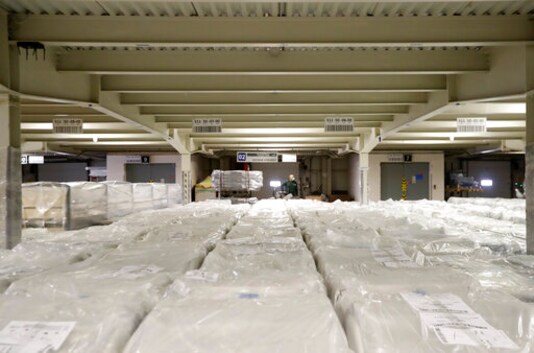 A worker drives past packed hospital beds, at the Linet factory in Slany, Czech Republic, Monday, Oct. 19, 2020. A Czech hospital bed maker with a full order book received one more order that was impossible to turn down. The company was approached by Prime Minister Andrej Babis to deliver beds for a military field hospital for 500 COVID-19 patients, to be built this week in Prague. (AP Photo/Petr David Josek) A worker drives past packed hospital beds, at the Linet factory in Slany, Czech Republic, Monday, Oct. 19, 2020. A Czech hospital bed maker with a full order book received one more order that was impossible to turn down. The company was approached by Prime Minister Andrej Babis to deliver beds for a military field hospital for 500 COVID-19 patients, to be built this week in Prague. (AP Photo/Petr David Josek)
