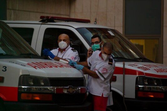 Paramedics stand by outside of the emergency department at Hadassah Medical Center in Jerusalem, where Senior Palestinian official Saeb Erekat is in critical condition with the coronavirus, Monday, Oct. 19, 2020. He was breathing with a ventilator after his infection worsened overnight, said the hospital. (AP Photo/Maya Alleruzzo) Paramedics stand by outside of the emergency department at Hadassah Medical Center in Jerusalem, where Senior Palestinian official Saeb Erekat is in critical condition with the coronavirus, Monday, Oct. 19, 2020. He was breathing with a ventilator after his infection worsened overnight, said the hospital. (AP Photo/Maya Alleruzzo)