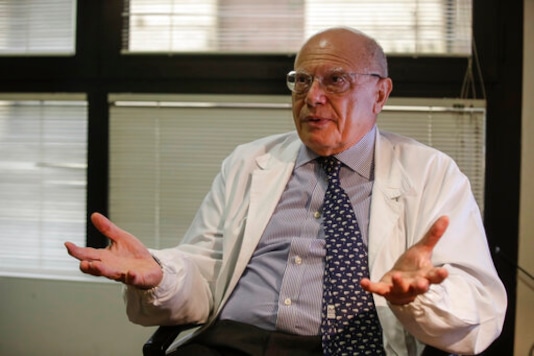 Virologist Massimo Galli, director of the Sacco hospital in Milan, answers questions during an interview with the Associated Press, at the Sacco hospital, in Milan, Italy, Thursday, Oct. 15, 2020. (AP Photo/Luca Bruno) Virologist Massimo Galli, director of the Sacco hospital in Milan, answers questions during an interview with the Associated Press, at the Sacco hospital, in Milan, Italy, Thursday, Oct. 15, 2020. (AP Photo/Luca Bruno)