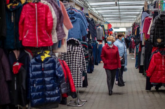 Women wearing face masks to protect against coronavirus shop at the Kalvarijos market in Vilnius, Lithuania, Thursday, Oct. 8, 2020. The Lithuanian government decided on Wednesday to tighten rules on public events in order to stem the spread of COVID-19. (AP Photo/Mindaugas Kulbis) Women wearing face masks to protect against coronavirus shop at the Kalvarijos market in Vilnius, Lithuania, Thursday, Oct. 8, 2020. The Lithuanian government decided on Wednesday to tighten rules on public events in order to stem the spread of COVID-19. (AP Photo/Mindaugas Kulbis)