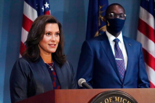 FILE - In this Wednesday, Sept. 2, 2020 file photo provided by the Michigan Office of the Governor, Gov. Gretchen Whitmer addresses the state during a speech in Lansing, Mich. Whitmer said Monday, Oct. 5, 2020, that a statewide mask requirement remains in effect despite the Michigan Supreme Court's invalidation of a law that underpins her orders to control the coronavirus pandemic. (Michigan Office of the Governor via AP, File) FILE - In this Wednesday, Sept. 2, 2020 file photo provided by the Michigan Office of the Governor, Gov. Gretchen Whitmer addresses the state during a speech in Lansing, Mich. Whitmer said Monday, Oct. 5, 2020, that a statewide mask requirement remains in effect despite the Michigan Supreme Court's invalidation of a law that underpins her orders to control the coronavirus pandemic. (Michigan Office of the Governor via AP, File)