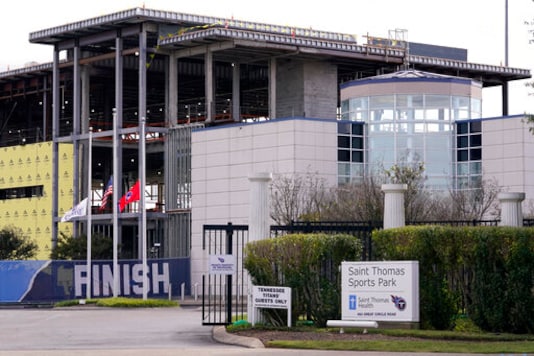 The entrance to the Tennessee Titans' practice facility is shown Tuesday, Sept. 29, 2020, in Nashville, Tenn. The Titans suspended in-person activities through Friday after the NFL said three Titans players and five personnel tested positive for the coronavirus, becoming the first COVID-19 outbreak of the NFL season in Week 4. The facility is now closed for four days to help limit the spread of the virus. (AP Photo/Mark Humphrey) The entrance to the Tennessee Titans' practice facility is shown Tuesday, Sept. 29, 2020, in Nashville, Tenn. The Titans suspended in-person activities through Friday after the NFL said three Titans players and five personnel tested positive for the coronavirus, becoming the first COVID-19 outbreak of the NFL season in Week 4. The facility is now closed for four days to help limit the spread of the virus. (AP Photo/Mark Humphrey)