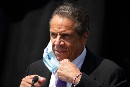 FILE - In this June 15, 2020, file photo, New York Gov. Andrew Cuomo removes a mask as he holds a news conference in Tarrytown, N.Y. The Justice Department vastly expanded its inquiry into whether New York is undercounting the number of nursing home residents dead from the coronavirus, demanding the state turn over death tallies from hundreds of private facilities. The demand ratchets up pressure on Cuomo after months of criticism from even members of his own party that the states official tally of those dead from the disease at long-term care facilities is likely undercounted. (AP Photo/Mark Lennihan, File) FILE - In this June 15, 2020, file photo, New York Gov. Andrew Cuomo removes a mask as he holds a news conference in Tarrytown, N.Y. The Justice Department vastly expanded its inquiry into whether New York is undercounting the number of nursing home residents dead from the coronavirus, demanding the state turn over death tallies from hundreds of private facilities. The demand ratchets up pressure on Cuomo after months of criticism from even members of his own party that the states official tally of those dead from the disease at long-term care facilities is likely undercounted. (AP Photo/Mark Lennihan, File)