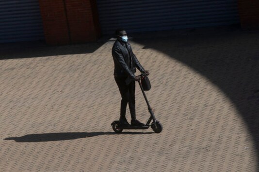 A passenger arrives at Atocha rail station on an electric scooter in Madrid, Spain, Saturday, Oct. 3, 2020. Madrid has started its first day under a partial lockdown with police controlling travel in and out of the Spanish capital. Spain's largest city has become the continent's biggest hot spot for the second wave of the coronavirus. The measures, affecting 4.8 million people, prohibit all nonessential trips in and out of the capital and nine of its suburbs. (AP Photo/Paul White) A passenger arrives at Atocha rail station on an electric scooter in Madrid, Spain, Saturday, Oct. 3, 2020. Madrid has started its first day under a partial lockdown with police controlling travel in and out of the Spanish capital. Spain's largest city has become the continent's biggest hot spot for the second wave of the coronavirus. The measures, affecting 4.8 million people, prohibit all nonessential trips in and out of the capital and nine of its suburbs. (AP Photo/Paul White)