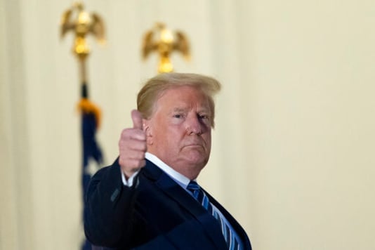 President Donald Trump gives thumbs up from the Blue Room Balcony upon returning to the White House Monday, Oct. 5, 2020, in Washington, after leaving Walter Reed National Military Medical Center, in Bethesda, Md. Trump announced he tested positive for COVID-19 on Oct. 2. (AP Photo/Alex Brandon) President Donald Trump gives thumbs up from the Blue Room Balcony upon returning to the White House Monday, Oct. 5, 2020, in Washington, after leaving Walter Reed National Military Medical Center, in Bethesda, Md. Trump announced he tested positive for COVID-19 on Oct. 2. (AP Photo/Alex Brandon)