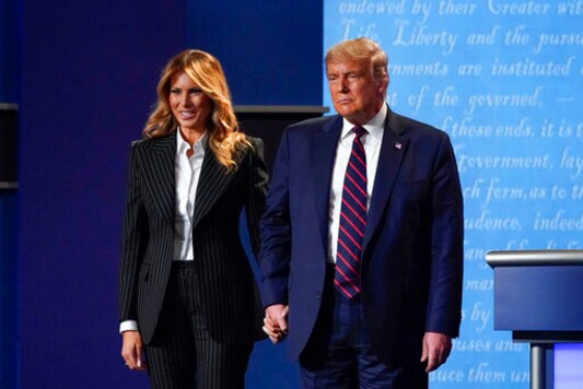 President Donald Trump and first lady Melania Trump hold hands on stage after the first presidential debate at Case Western University and Cleveland Clinic, in Cleveland, Ohio, Sept. 29, 2020. (AP Photo/Julio Cortez, File) President Donald Trump and first lady Melania Trump hold hands on stage after the first presidential debate at Case Western University and Cleveland Clinic, in Cleveland, Ohio, Sept. 29, 2020. (AP Photo/Julio Cortez, File)