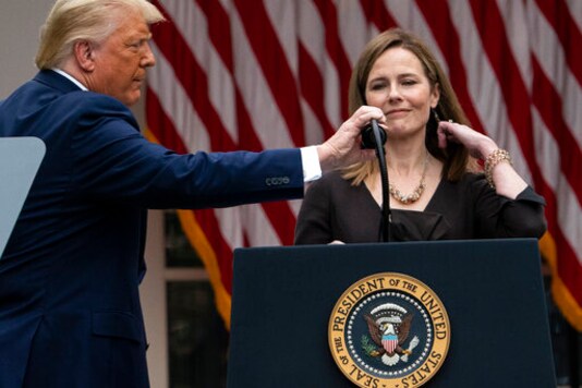 President Donald Trump adjusts the microphone after he announced Judge Amy Coney Barrett as his nominee to the Supreme Court, in the Rose Garden at the White House, Saturday, Sept. 26, 2020, in Washington. (AP Photo/Alex Brandon) President Donald Trump adjusts the microphone after he announced Judge Amy Coney Barrett as his nominee to the Supreme Court, in the Rose Garden at the White House, Saturday, Sept. 26, 2020, in Washington. (AP Photo/Alex Brandon)