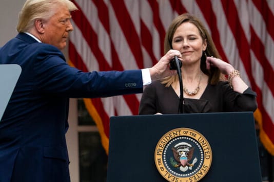 President Donald Trump adjusts the microphone after he announced Judge Amy Coney Barrett as his nominee to the Supreme Court, in the Rose Garden at the White House, Saturday, Sept. 26, 2020, in Washington. (AP Photo/Alex Brandon) President Donald Trump adjusts the microphone after he announced Judge Amy Coney Barrett as his nominee to the Supreme Court, in the Rose Garden at the White House, Saturday, Sept. 26, 2020, in Washington. (AP Photo/Alex Brandon)