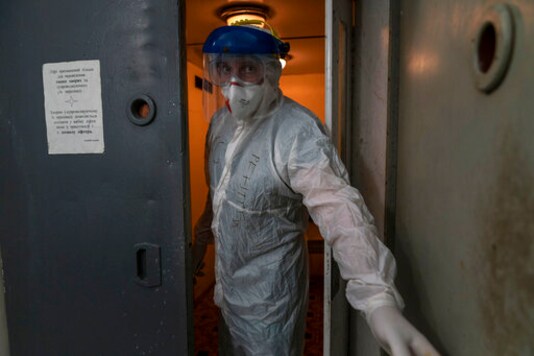 Dr. Oleh Hornostayev closes an elevator door going into a red zone at the city hospital in Stryi, Ukraine, on Tuesday, Sept. 29 2020. Coronavirus infections in Ukraine began surging in late summer, and the ripples are hitting towns in the western part of the country. The government wants to avoid imposing a new lockdown, but officials acknowledge that the rising infections could make it necessary. (AP Photo/Evgeniy Maloletka) Dr. Oleh Hornostayev closes an elevator door going into a red zone at the city hospital in Stryi, Ukraine, on Tuesday, Sept. 29 2020. Coronavirus infections in Ukraine began surging in late summer, and the ripples are hitting towns in the western part of the country. The government wants to avoid imposing a new lockdown, but officials acknowledge that the rising infections could make it necessary. (AP Photo/Evgeniy Maloletka)