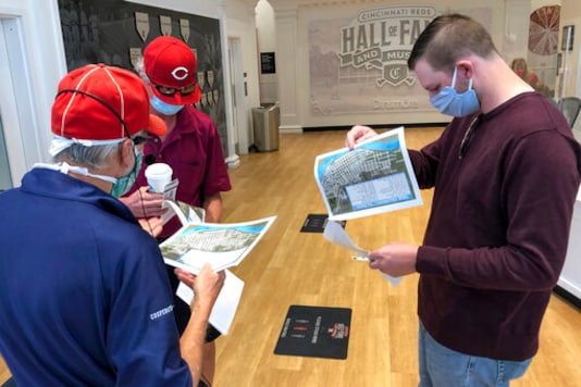 Researcher and tour guide Larry Phillips, left, talks with Bob Doherty, center, and his son Mack Doherty before a Researcher and tour guide Larry Phillips, left, talks with Bob Doherty, center, and his son Mack Doherty before a