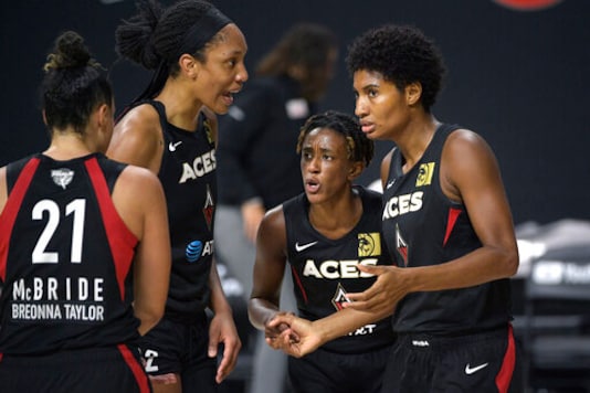 Las Vegas Aces guard Kayla McBride (21), center A'ja Wilson (22), guard Danielle Robinson, second from right, and forward Angel McCoughtry, right, huddle on the court during the first half of Game 2 of basketball's WNBA Finals against the Seattle Storm, Sunday, Oct. 4, 2020, in Bradenton, Fla. (AP Photo/Phelan M. Ebenhack) Las Vegas Aces guard Kayla McBride (21), center A'ja Wilson (22), guard Danielle Robinson, second from right, and forward Angel McCoughtry, right, huddle on the court during the first half of Game 2 of basketball's WNBA Finals against the Seattle Storm, Sunday, Oct. 4, 2020, in Bradenton, Fla. (AP Photo/Phelan M. Ebenhack)