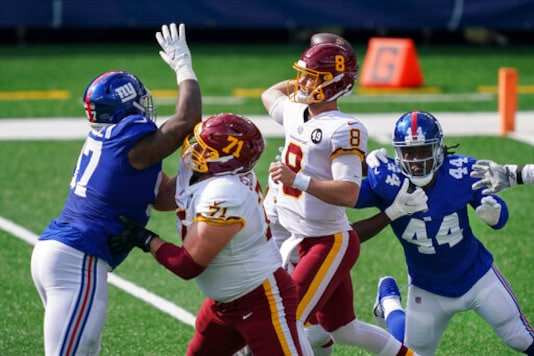 Washington Football Team offensive guard Wes Schweitzer (71) blocks New York Giants' Dexter Lawrence (97) as quarterback Kyle Allen (8) throws a pass during the first half of an NFL football game Sunday, Oct. 18, 2020, in East Rutherford, N.J. (AP Photo/John Minchillo) Washington Football Team offensive guard Wes Schweitzer (71) blocks New York Giants' Dexter Lawrence (97) as quarterback Kyle Allen (8) throws a pass during the first half of an NFL football game Sunday, Oct. 18, 2020, in East Rutherford, N.J. (AP Photo/John Minchillo)