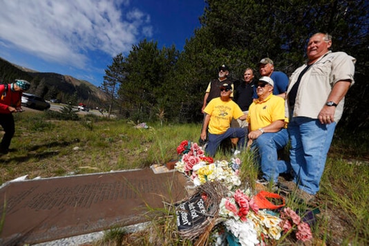 membrs of the 1970 Wichita State University Shockers football team stand around a plaque for their teammates who died in an airplane crash as the survivors visit the crash site near Loveland Pass Monday, July 27, 2020, west of Silver Plume, Colo. Wreckage from the plane, which was one of two being used to take the Shockers to play a football game against Utah State University in Logan, Utah, is still scattered on the mountain top nearly 50 years after the crash close to the Eisenhower Tunnel. (AP Photo/David Zalubowski) membrs of the 1970 Wichita State University Shockers football team stand around a plaque for their teammates who died in an airplane crash as the survivors visit the crash site near Loveland Pass Monday, July 27, 2020, west of Silver Plume, Colo. Wreckage from the plane, which was one of two being used to take the Shockers to play a football game against Utah State University in Logan, Utah, is still scattered on the mountain top nearly 50 years after the crash close to the Eisenhower Tunnel. (AP Photo/David Zalubowski)