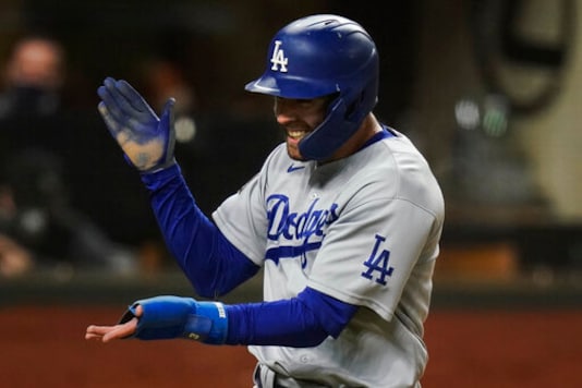 Los Angeles Dodgers' Chris Taylor celebrates after scoring on a single by Corey Seager during the eighth inning in Game 4 of the baseball World Series against the Tampa Bay Rays Saturday, Oct. 24, 2020, in Arlington, Texas.(AP Photo/Eric Gay) Los Angeles Dodgers' Chris Taylor celebrates after scoring on a single by Corey Seager during the eighth inning in Game 4 of the baseball World Series against the Tampa Bay Rays Saturday, Oct. 24, 2020, in Arlington, Texas.(AP Photo/Eric Gay)