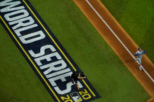Los Angeles Dodgers first baseman Max Muncy celebrates a home run against the Tampa Bay Rays during the fifth inning in Game 5 of the baseball World Series Sunday, Oct. 25, 2020, in Arlington, Texas.(AP Photo/David J. Phillip) Los Angeles Dodgers first baseman Max Muncy celebrates a home run against the Tampa Bay Rays during the fifth inning in Game 5 of the baseball World Series Sunday, Oct. 25, 2020, in Arlington, Texas.(AP Photo/David J. Phillip)