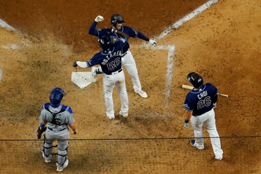 Tampa Bay Rays' Brandon Lowe celebrates his three-run home run against the Los Angeles Dodgers during the sixth inning in Game 4 of the baseball World Series Saturday, Oct. 24, 2020, in Arlington, Texas. (AP Photo/David J. Phillip) Tampa Bay Rays' Brandon Lowe celebrates his three-run home run against the Los Angeles Dodgers during the sixth inning in Game 4 of the baseball World Series Saturday, Oct. 24, 2020, in Arlington, Texas. (AP Photo/David J. Phillip)