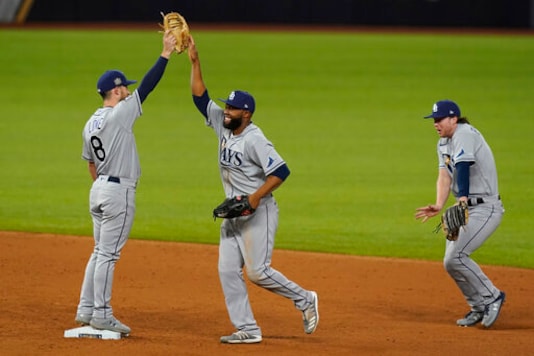 The Tampa Bay Rays celebrates their win against the Los Angeles Dodgers in Game 2 of the baseball World Series Wednesday, Oct. 21, 2020, in Arlington, Texas. Ray beat the Dodgers 6-4.(AP Photo/Eric Gay) The Tampa Bay Rays celebrates their win against the Los Angeles Dodgers in Game 2 of the baseball World Series Wednesday, Oct. 21, 2020, in Arlington, Texas. Ray beat the Dodgers 6-4.(AP Photo/Eric Gay)