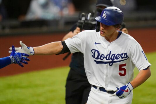 Los Angeles Dodgers' Corey Seager celebrates his home run against the Tampa Bay Rays during the eighth inning in Game 2 of the baseball World Series Wednesday, Oct. 21, 2020, in Arlington, Texas. (AP Photo/Eric Gay) Los Angeles Dodgers' Corey Seager celebrates his home run against the Tampa Bay Rays during the eighth inning in Game 2 of the baseball World Series Wednesday, Oct. 21, 2020, in Arlington, Texas. (AP Photo/Eric Gay)