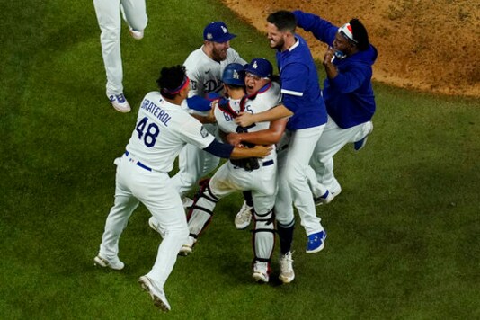 Los Angeles Dodgers celebrate after defeating the Tampa Bay Rays 3-1 to win the baseball World Series in Game 6 Tuesday, Oct. 27, 2020, in Arlington, Texas. (AP Photo/David J. Phillip)