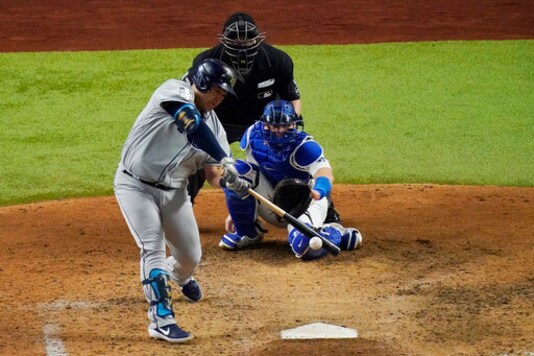 Tampa Bay Rays' Ji-Man Choi singles against the Los Angeles Dodgers during the sixth inning in Game 2 of the baseball World Series Wednesday, Oct. 21, 2020, in Arlington, Texas. (AP Photo/Sue Ogrocki) Tampa Bay Rays' Ji-Man Choi singles against the Los Angeles Dodgers during the sixth inning in Game 2 of the baseball World Series Wednesday, Oct. 21, 2020, in Arlington, Texas. (AP Photo/Sue Ogrocki)