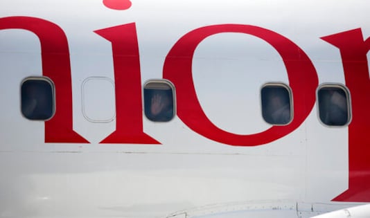 Yemeni prisoners peer through windows of a plane during their arrival after being released by the Saudi-led coalition at the airport in Sanaa, Yemen, Thursday, Oct. 15, 2020. (AP Photo/Hani Mohammed) Yemeni prisoners peer through windows of a plane during their arrival after being released by the Saudi-led coalition at the airport in Sanaa, Yemen, Thursday, Oct. 15, 2020. (AP Photo/Hani Mohammed)