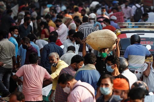 People are seen at a crowded market amidst the spread of the coronavirus disease (COVID-19). (Reuters)