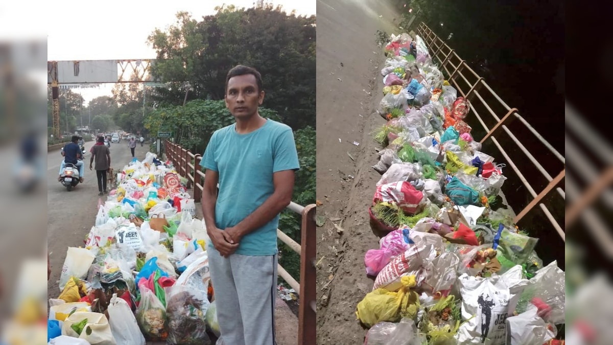 Man Stands Beside Godavari River to Prevent People From Dumping Garbage-Filled Plastic Bags