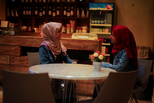 Women talk as they sit in the only all-female internet cafe in Marib, Yemen. (REUTERS/Nusaibah Almuaalemi)