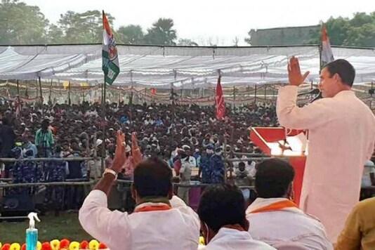 Congress leader Rahul Gandhi addresses a gathering during an election rally, in West Champaran. (Image: PTI)