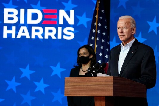 Democratic presidential candidate Joe Biden speaks on Nov. 5, 2020, in Wilmington, Delaware as Kamala Harris stands at left. (AP Photo/Carolyn Kaster)