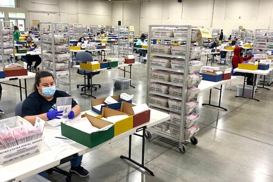 Workers check ballots for mistakes before they are processed by the Los Angeles County Registrar at the temporary building at the Pomona Fairplex in Pomona, Calif., Thursday, Nov. 5, 2020. (Keith Birmingham/The Orange County Register via AP) Workers check ballots for mistakes before they are processed by the Los Angeles County Registrar at the temporary building at the Pomona Fairplex in Pomona, Calif., Thursday, Nov. 5, 2020. (Keith Birmingham/The Orange County Register via AP)