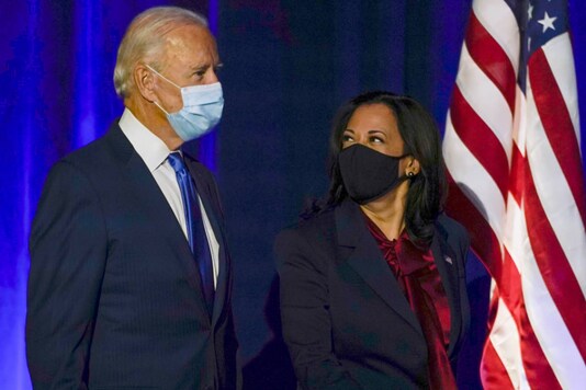 Democratic presidential candidate former Vice President Joe Biden arrives with his running mate Sen. Kamala Harris, D-Calif., to speak Friday, Nov. 6, 2020, in Wilmington, Del. (AP Photo/Carolyn Kaster)
