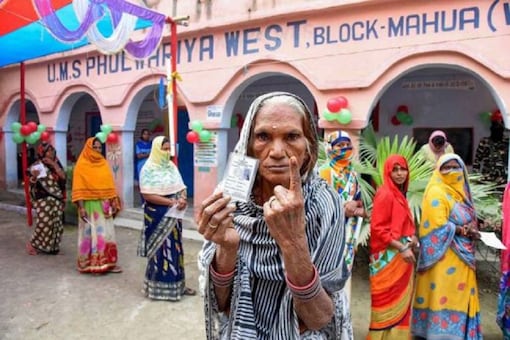 A woman casts her vote during the Bihar elections