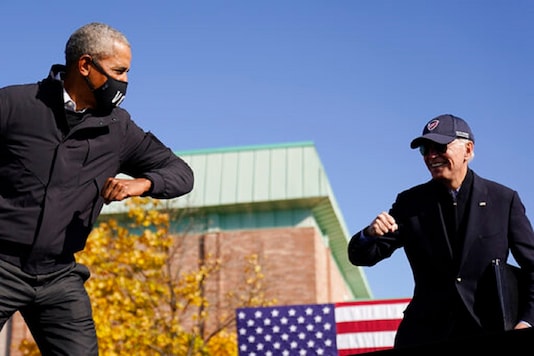 File photo of US presidential-elect candidate Joe Biden with former President Barack Obama greeting each other with an air elbow bump, at the conclusion of rally at Northwestern High School in Flint, Mich. (AP) File photo of US presidential-elect candidate Joe Biden with former President Barack Obama greeting each other with an air elbow bump, at the conclusion of rally at Northwestern High School in Flint, Mich. (AP)