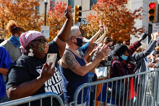 People react as media announce that Democratic U.S. presidential nominee Joe Biden has won the 2020 U.S. presidential election, in, Philadelphia, Pennsylvania, U.S., November 7, 2020. (REUTERS)