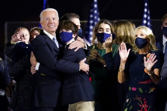 President-elect Joe Biden and Jill Biden stand with their family and watch fireworks after speaking in Wilmington, Del., Saturday, Nov. 7, 2020. (AP Photo/Paul Sancya) President-elect Joe Biden and Jill Biden stand with their family and watch fireworks after speaking in Wilmington, Del., Saturday, Nov. 7, 2020. (AP Photo/Paul Sancya)