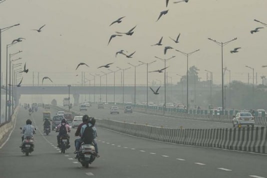 Vehicles ply amid hazy weather conditions, in New Delhi. (Image: PTI)