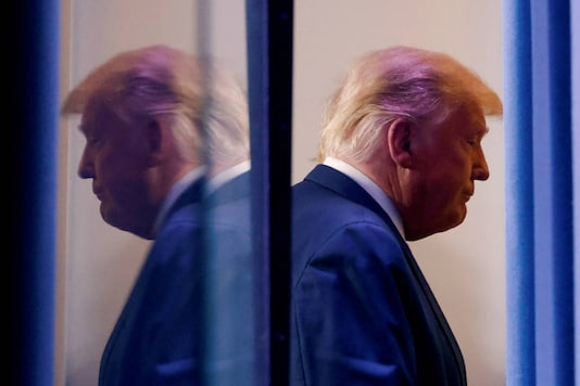 US President Donald Trump is reflected as he departs after speaking about the presidential election results in the Brady Press Briefing Room at the White House in Washington, US, November 5, 2020. (REUTERS/Carlos Barria/File Photo)