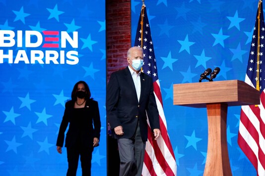Democratic presidential nominee Joe Biden and his running mate, Sen. Kamala Harris (D-Calif.) take to the stage during a campaign event in Wilmington, Del., Nov. 5, 2020. (Erin Schaff/The New York Times) 