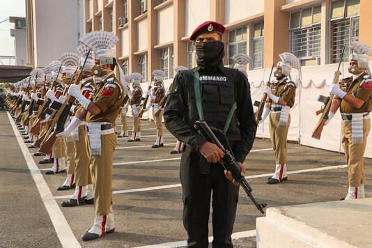 Police officers present a guard of honour to Lieutenant Governor of Jammu and Kashmir, Manoj Sinha (unseen), during the reopening of the Civil Secretariat in Jammu, Monday, Nov. 9, 2020. (PTI Photo) 
