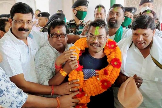 Dumka: Jharkhand Mukti Morcha (JMM) candidate Basant Soren along with party workers celebrates his victory in the Dumka Assembly by-election, in Dumka, Tuesday, Nov. 10, 2020. (PTI Photo)